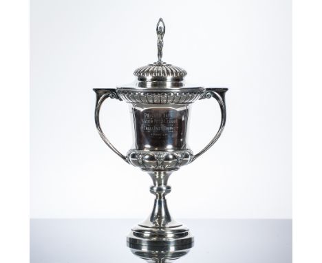 GEORGE V TWIN-HANDLED TROPHY CUP
maker Joseph Gloster Ltd., Birmingham 1929, lid with driving bather finial, engraved 'Privat