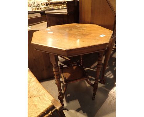 Small Edwardian hexagonal top table with lower shelf and porcelain castors