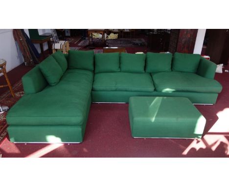 A large green upholstered L shaped sofa, with matching ottoman, 'At Crorin Workshop' label to verso, H.78 W.348 D.128cm (sofa