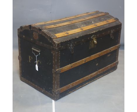 An early 20th century iron bound dome top trunk, H.60 W.90 D.52cm 