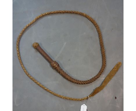 A vintage 8ft brown leather bull whip 