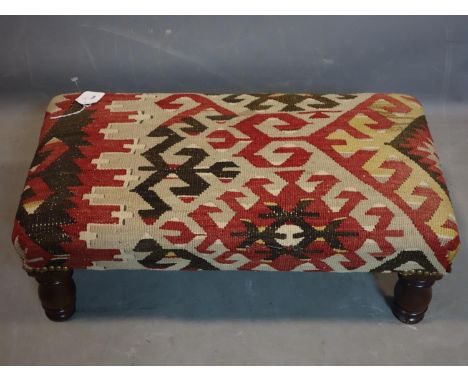 A vintage kelim stool raised on turned legs, H.22 W.63 D.36cm 