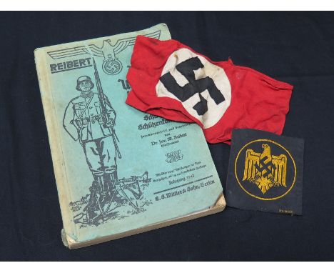 German WW2 1943 dated infantry manual with Nazi party arm band and cloth badge