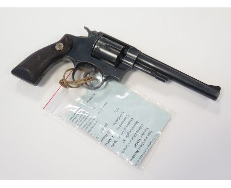 Revolver: A Spanish 'RUBY EXTRA' .22 calibre revolver. Barrel 5". Blued finish, wood grips with 'Ruby' logo. Good working ord