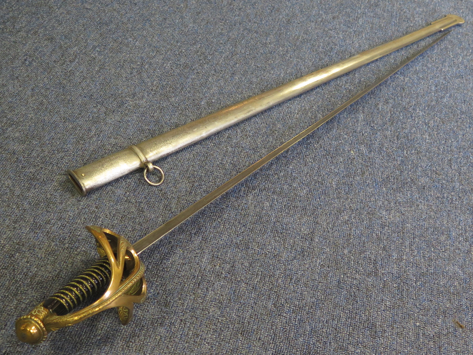 Sword A French Model 1896 Cavalry officers sword in its steel scabbard