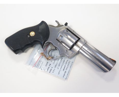 Revolver: A large and impressive .357 Magnum Colt 'KING COBRA' bright steel finish. Hard rubber grips with colt medallion. Ba