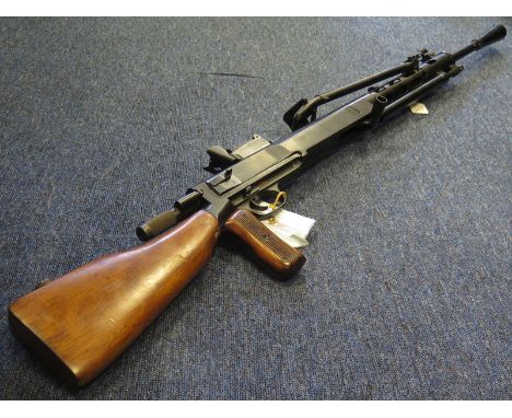 Machine Gun: A Russian Light Machine Gun Model DPM44. cal: 7.62mm with drum magazine. Action cocks and fires. In very good w/