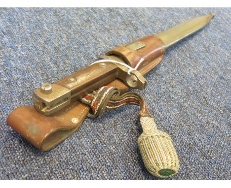 Bayonet: An Austrian Model 1895 NCO's knife bayonet in its steel scabbard with troddel knot and leather frog. Light rusting t