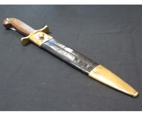 Knife: A replica U.S. Pattern 1849 knife in its brass mounted leather scabbard. Blade marked US & WD. & Ames Mfg Co. Cabotsvi