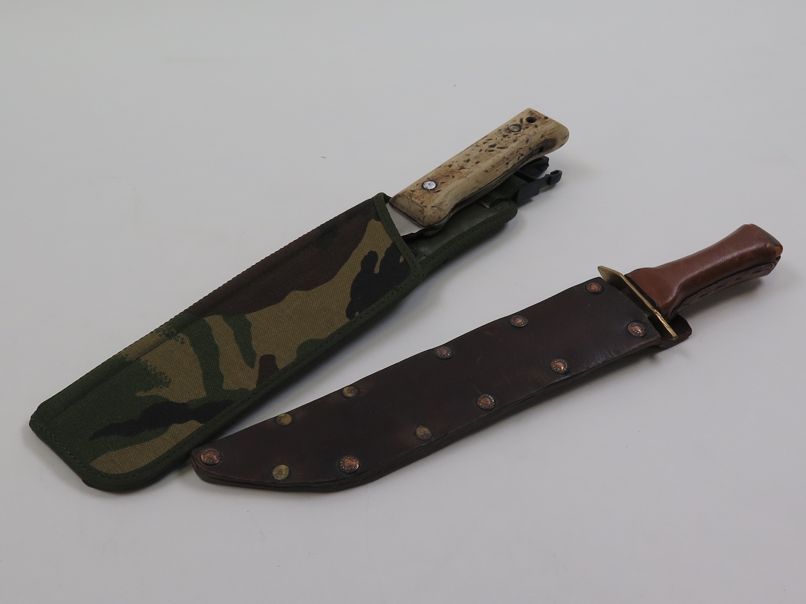 British Army Jungle machete, new condition. Plus modern Bowie Type knife. (2)