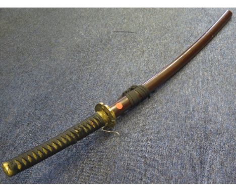 Sword: A civilian Japanese Katana, blade 28.5". In its lacquered wooden scabbard. Dates post war. 