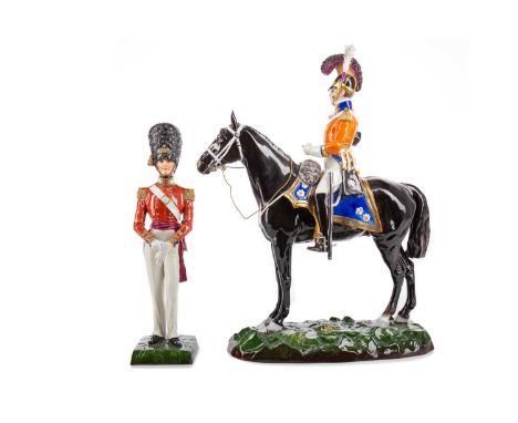 TWO SITZENDORF MILITARY FIGURES,the first a mounted Officer of the 1st Life Guards 1815, no. 1452/0/10R, 38cm high, the secon