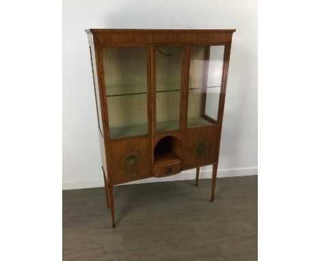 EDWARDIAN PAINTED SATINWOOD DISPLAY CABINET IN THE MANNER OF MAPLE &amp; CO.,the frieze with central scroll detail over a fol