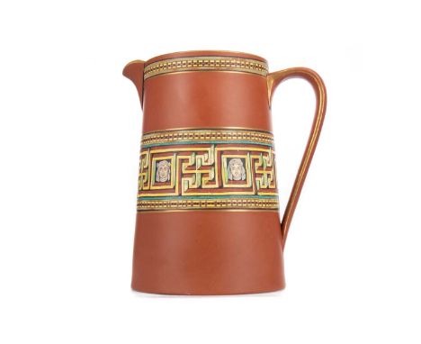 LATE 19TH/EARLY 20TH CENTURY TERRACOTTA WATER JUG,of tapered form, with bands of geometric, Greek key and mask decoration, st