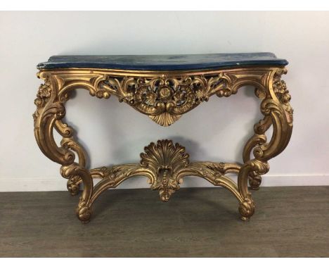 LOUIS XVI STYLE GILTWOOD CONSOLE TABLE,of serpentine outline, the simulated marble top over a scroll and foliate pierced and 