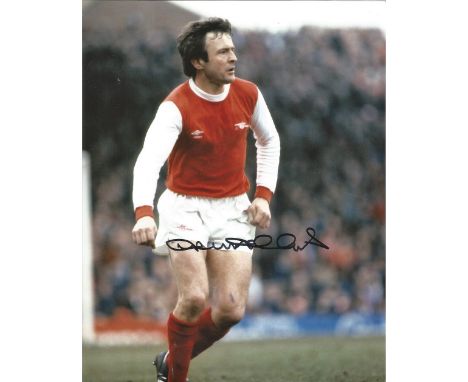 Football legend, John Hollins 10x8 Signed Colour Photograph Pictured In Action For Arsenal. Good condition. All autographs co