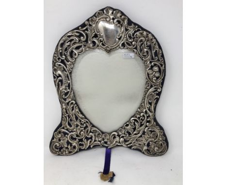 A pierced silver heart shaped easel mirror. Maker Deacon and Frances, Birmingham 1904.