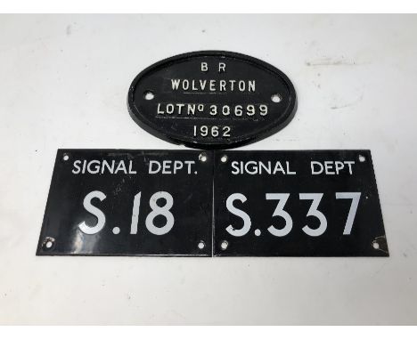 Two enamel railway Signal Dept. signs S.337 and S.18, 52cm x 10.2cm, and an oval B.R. Wolverton Lot No. 30699 1962 plaque, 19