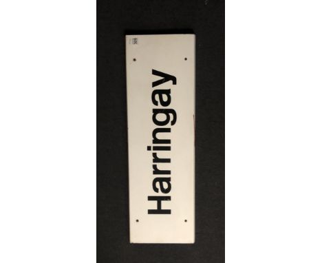 A vintage railway station platform sign: Harringay - East Coast Main Line, white with black lettering, 90cm x 29cm.