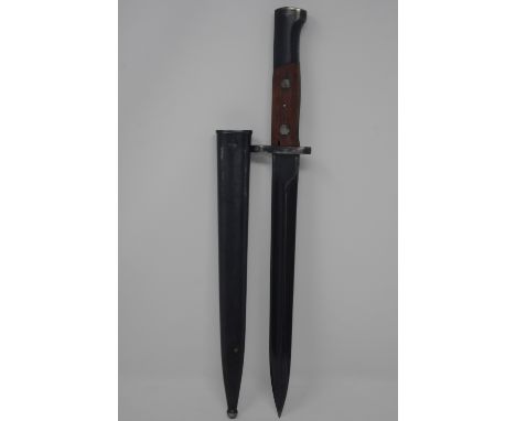 A Yugoslav knife bayonet with steel scabbard. Having matching serial numbers. Blade length 25cm.