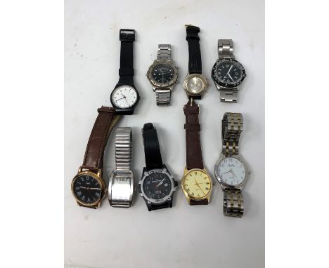 An assortment of wristwatches of various makes including Timex Expedition and one marked Rolex Perpetual Date.