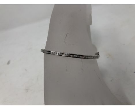 A silver and CZ set bangle.