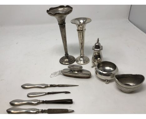 Two silver handled button hooks, Birmingham hallmarks, a pair of silver handled and ivory glove stretchers, a Mappin Brothers