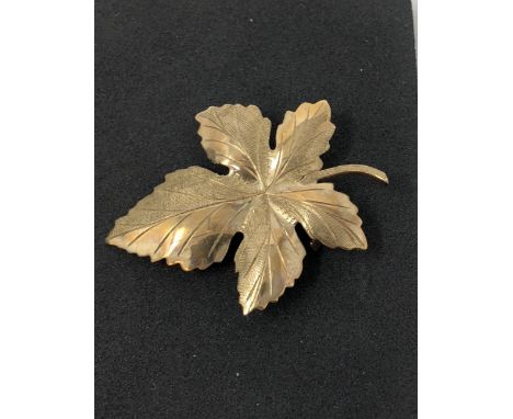 A 9ct gold maple leaf brooch, weight approximately 3.2 grams and a 9ct gold and pearl dress ring, size O, weight approximatel