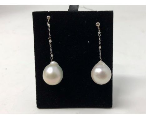 A pair of white gold and South Sea pearl drop earrings.