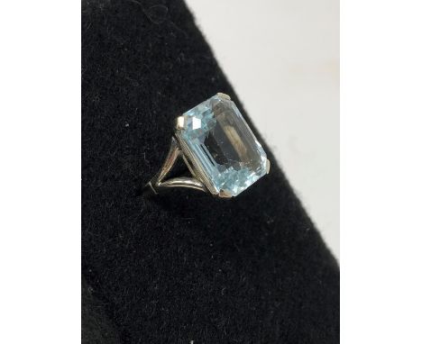 An aquamarine and 14ct white gold dress ring, stone size 11mm x 14mm, ring size K.