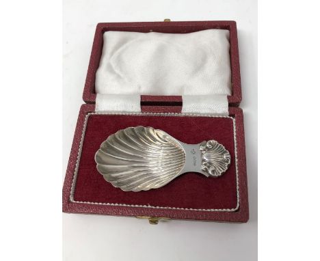 A cased silver caddy spoon with shell bowl, maker Francis Howard Ltd, Sheffield 1973.