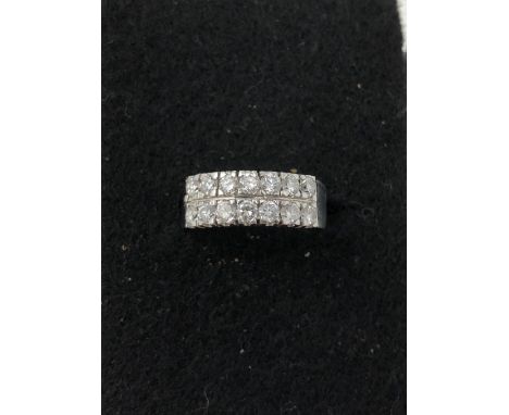 A white gold 14 stone diamond ring, size L/M. Approximate weight 3.9 grams.