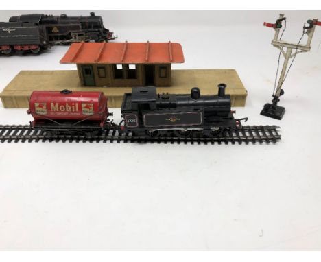 An assortment of early and later Hornby 00 gauge, including tinplate carriages, rolling stock, a Marklin tender, a British Ra
