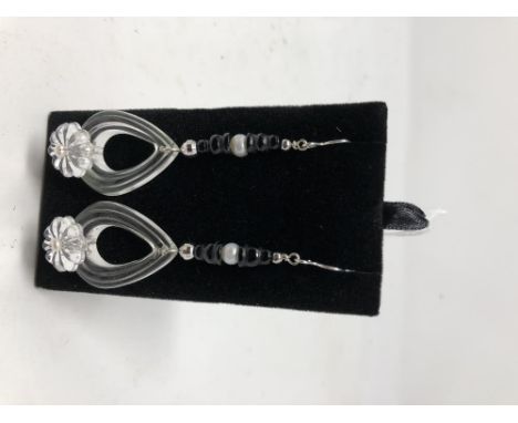 A pair of unusual drop earrings set with pearl and onyx.
