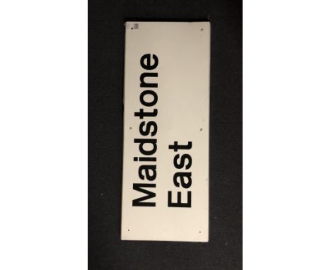 A vintage railway station platform sign: Maidstone East - Maidstone East Line, white with black lettering, 100cm x 39cm.