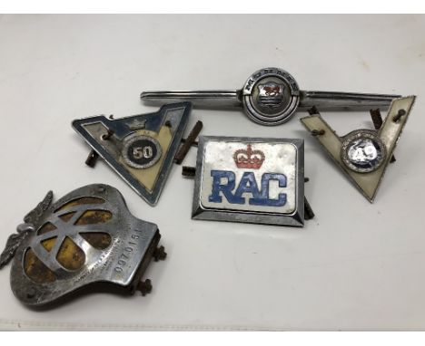 Six assorted car badges including Morris, The Royal Automobile Club Association, A.A. No. 0970151, etc.