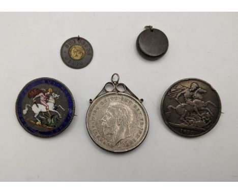 Mixed coins to include a George III garter crown A/F, enamelled and brooched, a 1821 crown converted to a brooch, Victoria on