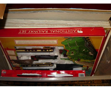 A collection of mixed complete puzzles housed on backing card together with a traditional railway train set, an Airfix RMS Qu