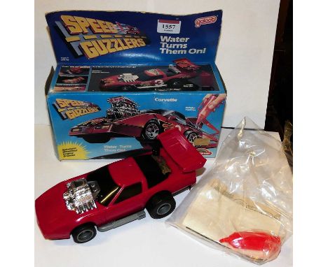 A Rainbow Toys by Galoob boxed plastic and friction drive model of a Speed Guzzler Corvette, housed in the original box with 