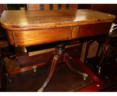 A circa 1830 mahgoany and crossbanded round cornered fold-over card table, with maroon rexine inset surface, on outswept supp