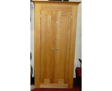 A contemporary light oak double door wardrobe, width 103.5cm