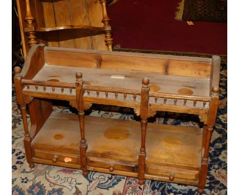 A rustic pine shaped three-tier hanging corner shelf; together with a pine table-top shelf, having three lower drawers (2)