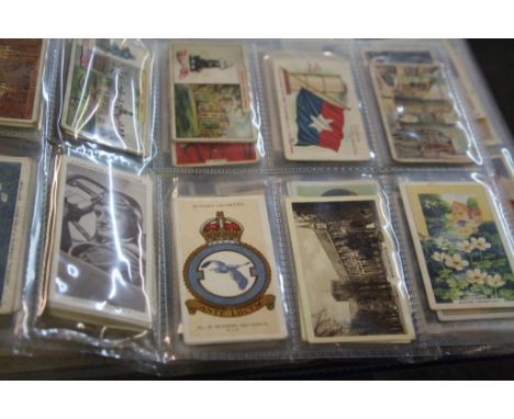 Three folders and a small collection of Albums of vintage Cigarette cards etc to include; Churchman, WD &amp; HO Wills, John 