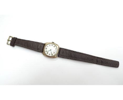 A 9ct gold cushion cased Longines wristwatch with luminous hands and seconds dial on leather strap, stamped on movement 57545