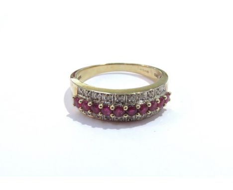 A 9ct gold three row ruby and diamond half hoop ring. Size T, 4.1g