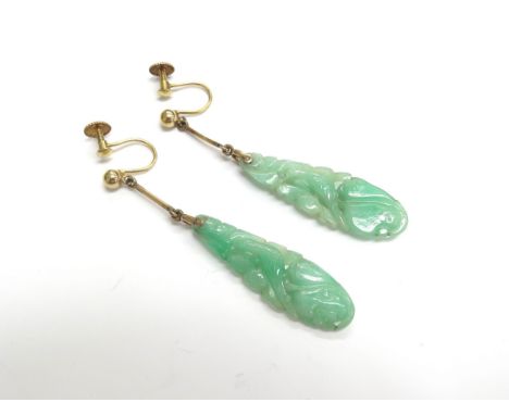 A pair of carved jade earrings depicting birds, back stamped 9ct, 5.3cm long