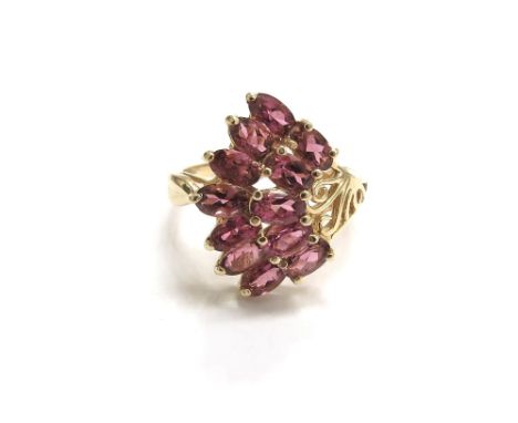 A 9ct gold fan shaped ring set with a cluster of pink tourmalines. Size R, 5.3g