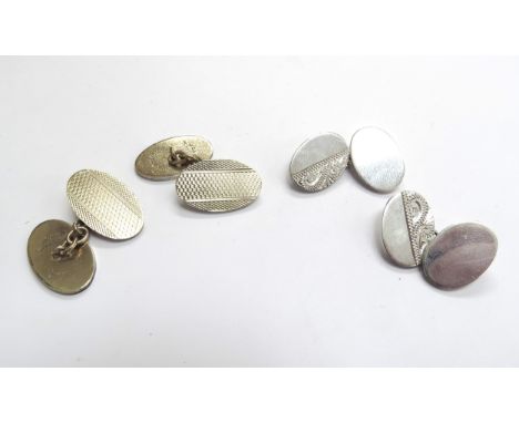 A pair of silver cufflinks and a pair of gold plated silver cufflinks