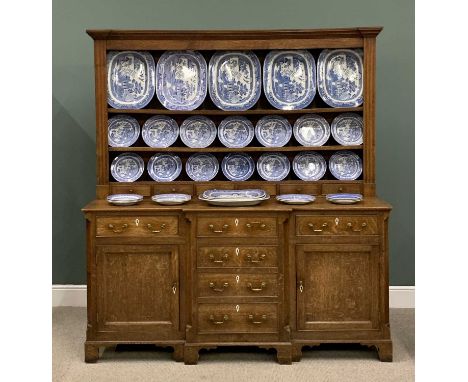 NORTH WALES OAK BREAKFRONT DRESSER CIRCA 1850, having wide backboards to a three-shelf rack and a run of six opening spice dr