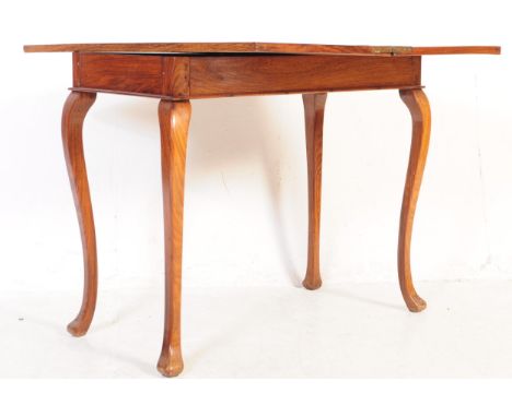 An early 20th century oak card / games table. Of rectangular form with swivel and folding action opening to a bigger playing 